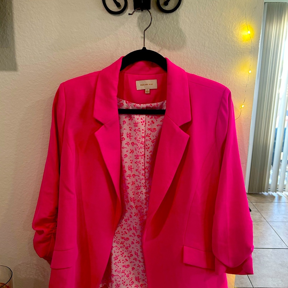 Pink Blazer with Classic Lapel and 3/4 Sleeves. Flower detailing.